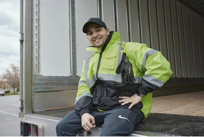 CDL Student sitting in the back of a truck