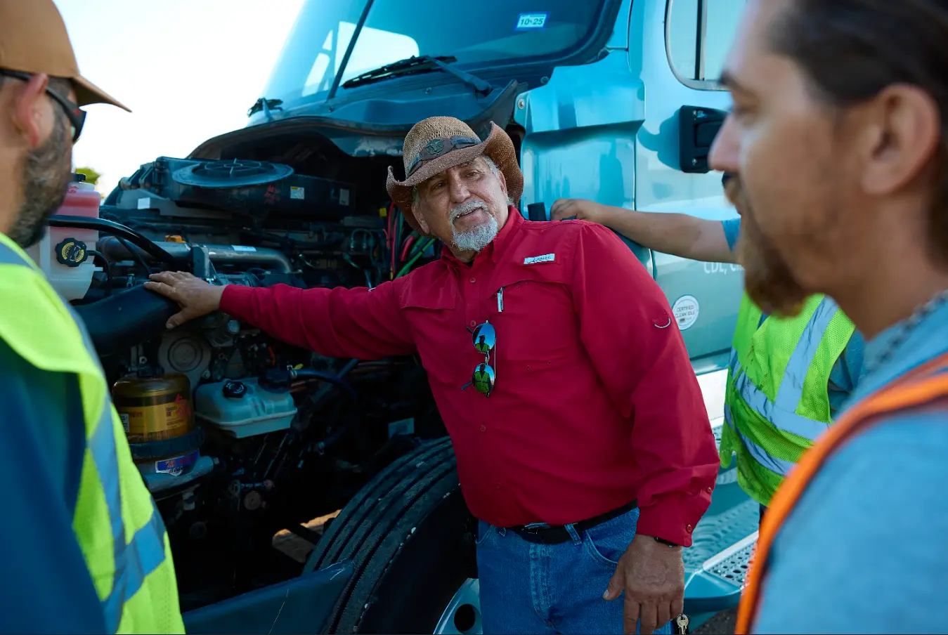 cdl students and instructor inspecting truck.webp