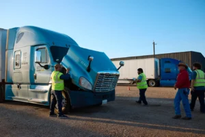 cdl students and instructors inspecting a truck.webp