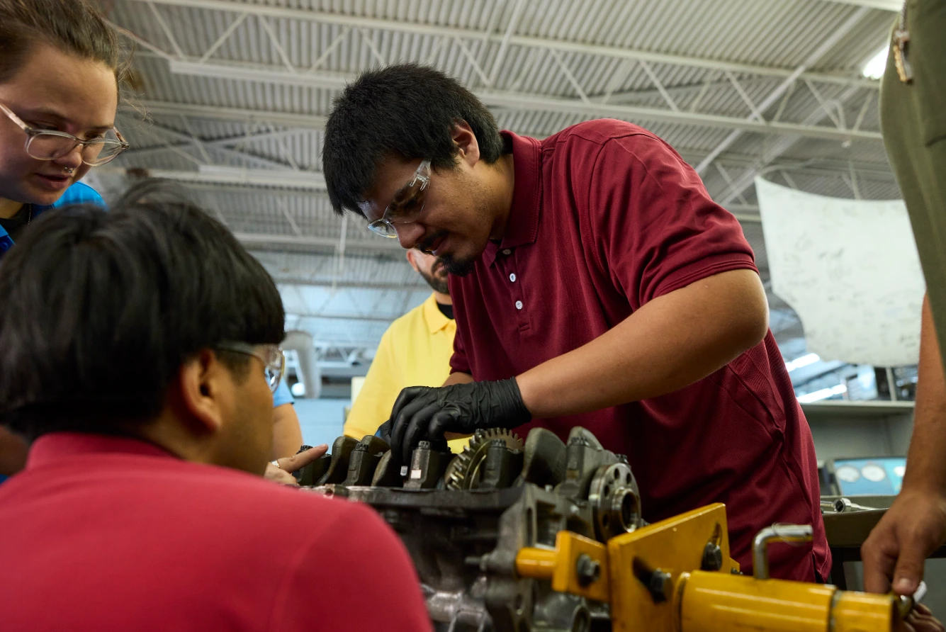automotive tech students working on machinery